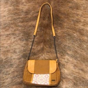 Nice brown handbag with embroidered front design.